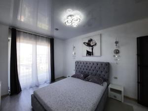 Un pat sau paturi într-o cameră la Mamaia Apartament Bucurie si Liniste