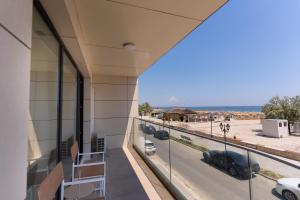 a view from the balcony of a building with a parking lot at Milena in Mamaia Sat/Năvodari