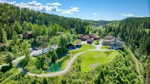 an aerial view of a house in a forest at Kleivstua Hotel in Sundvollen