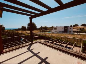 a view of the ocean from the balcony of a house at Villa Villa Perla by Interhome in Bonmont Terres Noves