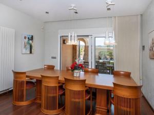 a dining room with a wooden table and chairs at Villa Finca Villa Roig by Interhome in Peniscola