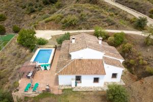 an aerial view of a house with a swimming pool at Casa Rural Los Hidalgos in Tolatán