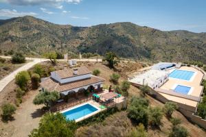 an aerial view of a house with two swimming pools at Casa Rural Los Hidalgos in Tolatán