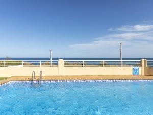 Bazén v ubytovaní Apartment Cala Lidia by Interhome alebo v jeho blízkosti