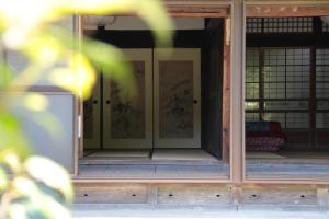a room with glass doors in a building at 小川町 古民家田淵 -villa tabuchi- in Ogose
