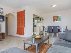 a living room with a couch and a table at Holiday Home Villa Cuba by Interhome in Peñíscola