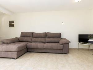 Televízia a/alebo spoločenská miestnosť v ubytovaní Holiday Home Villa Cuba by Interhome