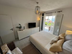 Postel nebo postele na pokoji v ubytování Apartments Kale Center