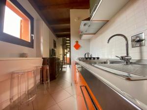 a kitchen with a sink and a counter top at Apartment Orcagna apartment by Interhome in Florence