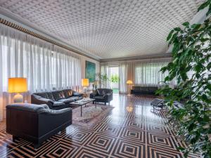 a living room with a couch and a table at Holiday Home Casa Giacomelli by Interhome in Mathi