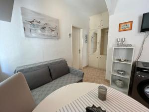 a living room with a couch and a table at Apartment Merlin in Bol