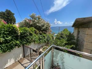 a balcony with a view of the ocean at Apartment Merlin in Bol