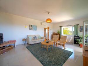 a living room with a couch and a table at Villa Vista by Interhome in Cortes