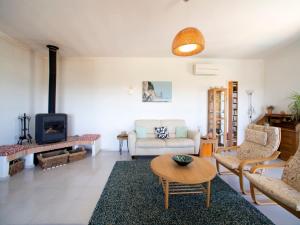 a living room with a couch and a fireplace at Villa Vista by Interhome in Cortes +19 photos