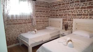 Postel nebo postele na pokoji v ubytování Gizemli Konak