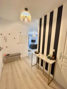a living room with a bench and a table at Appartement avec piscine in Calvi