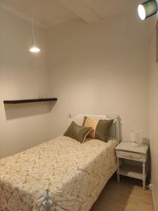 Postel nebo postele na pokoji v ubytování Casa da Farmácia - Paredes de Coura