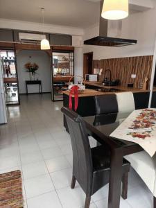 a kitchen and dining room with a table and chairs at Casa da Farmácia - Paredes de Coura in Paredes de Coura