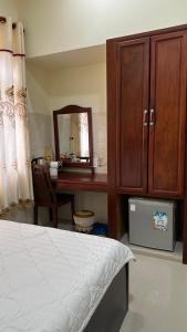 Postel nebo postele na pokoji v ubytování Ngọc Nam Hotel