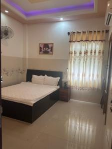 Postel nebo postele na pokoji v ubytování Ngọc Nam Hotel