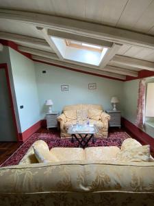 a living room with a couch and a table at Antica Casa Fenaroli in Iseo