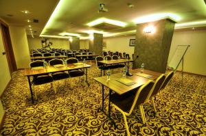 The business area and/or conference room at Golden Deluxe Hotel