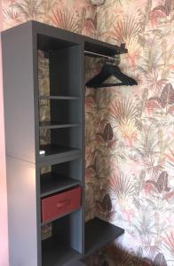 a wardrobe in a room with a wall at Appartement Mimosa Croisette in Cannes