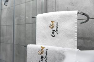 two towels on a towel rack in a bathroom at Turkus Holiday in Pobierowo +38 photos