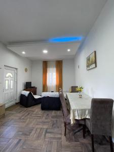 a living room with a table and a bed at Apartment Jovana in Herceg-Novi