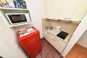 Kuchyň nebo kuchyňský kout v ubytování Apartmani Melia