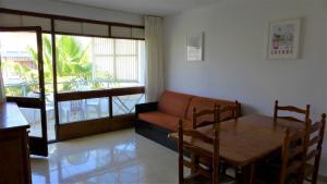 a living room with a couch and a table at Apartamentos Colon in Salou