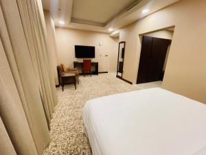 Телевизор и/или развлекательный центр в Grand Legacy Hotel Doha