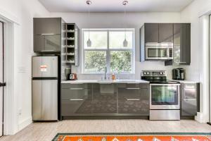 a kitchen with stainless steel appliances and a window at Owl Creek Studio in Stevenson