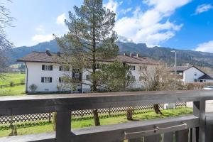 a white house with a fence in front of it at Backauf in Bad Hindelang