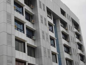 a tall apartment building with windows at Tuliip Residency in Mumbai