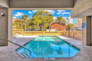 a swimming pool in the middle of a building at Spacious Ocean View Suite With Beautiful Updates! - Ocean Dunes Tower 2 Unit 6121 - Sleeps 6 Guests! in Myrtle Beach