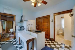 a kitchen with a sink and a counter top at Dtwn Victorian Home - 1 Mi to Lake Michigan Beach! in Manistee +24 photos