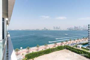 a view of the ocean from the balcony of a building at Dream Inn Apartments - Mina by Azizi in Dubai