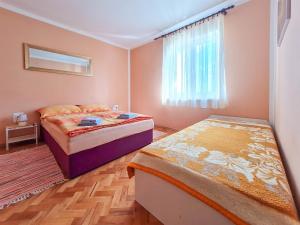 Posteľ alebo postele v izbe v ubytovaní Apartment Roses