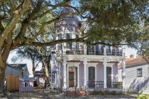an old house with a tower on top of it at Carondelet House - 1886 Garden District Manse in New Orleans