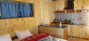 A kitchen or kitchenette at Chosdup Guest House