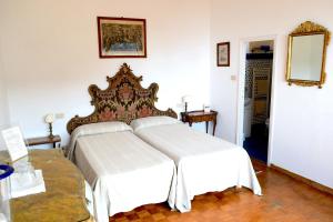 Ένα ή περισσότερα κρεβάτια σε δωμάτιο στο Villa Il Respiro