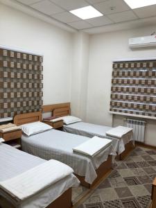 Ένα ή περισσότερα κρεβάτια σε δωμάτιο στο Отель Дружба Народов