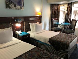 Postel nebo postele na pokoji v ubytování Santana Hotel Cairo