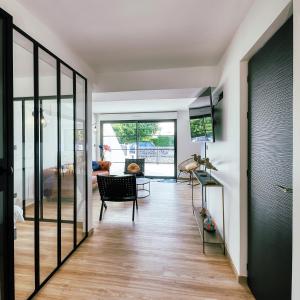 a living room with a sliding glass door at Grande Plage in Saint-Georges-de-Didonne