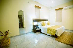 Katil atau katil-katil dalam bilik di Apartment 79 Hotel & Suite