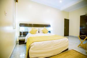 Katil atau katil-katil dalam bilik di Apartment 79 Hotel & Suite