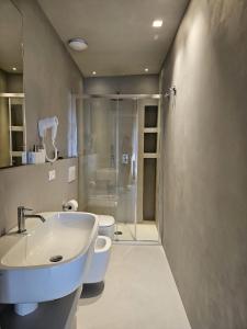 a bathroom with a sink and a shower at Piccola Dimora Gherardini in SantʼElpidio a Mare