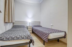 Postel nebo postele na pokoji v ubytování Ponent 3 2 Roses - Immo Barneda