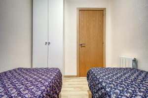 Postel nebo postele na pokoji v ubytování Ponent 3 2 Roses - Immo Barneda